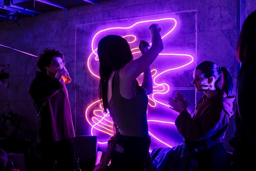 Guests dancing under neon lights